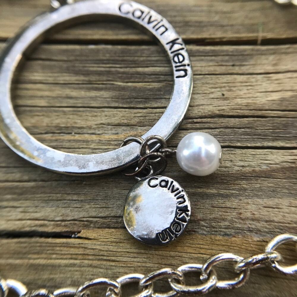 Calvin Klein branded large circle dangle faux pearl accent pendant necklace